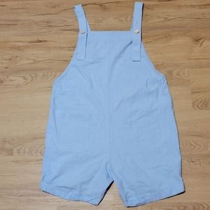 Large blue overalls with pockets and buttons